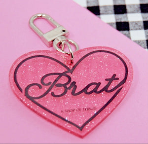 
            
                Load image into Gallery viewer, Brat Glitter Acrylic Heart Keychain
            
        